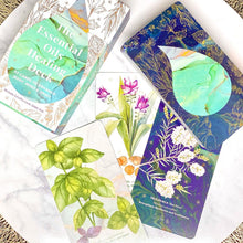 Load image into Gallery viewer, The various cards from the Essential Oil Healing Oracle Deck layed on a table.
